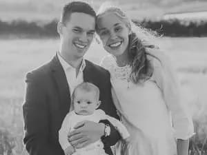 Team member holding a baby