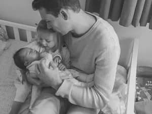 Team member with baby in nursery